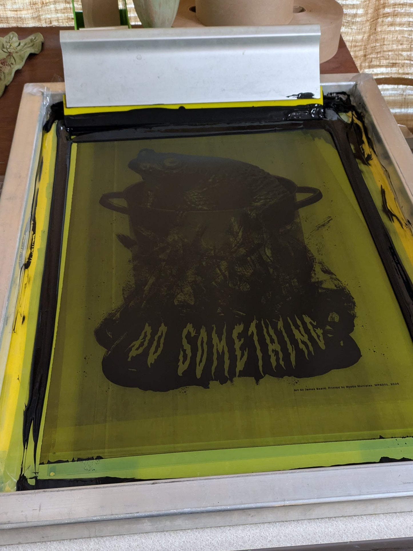 Screen printed poster with a flood of black ink