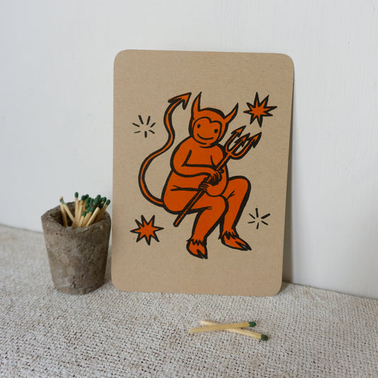 Orange and black illustration of a cartoon devil on kraft color paper with rounded corners.