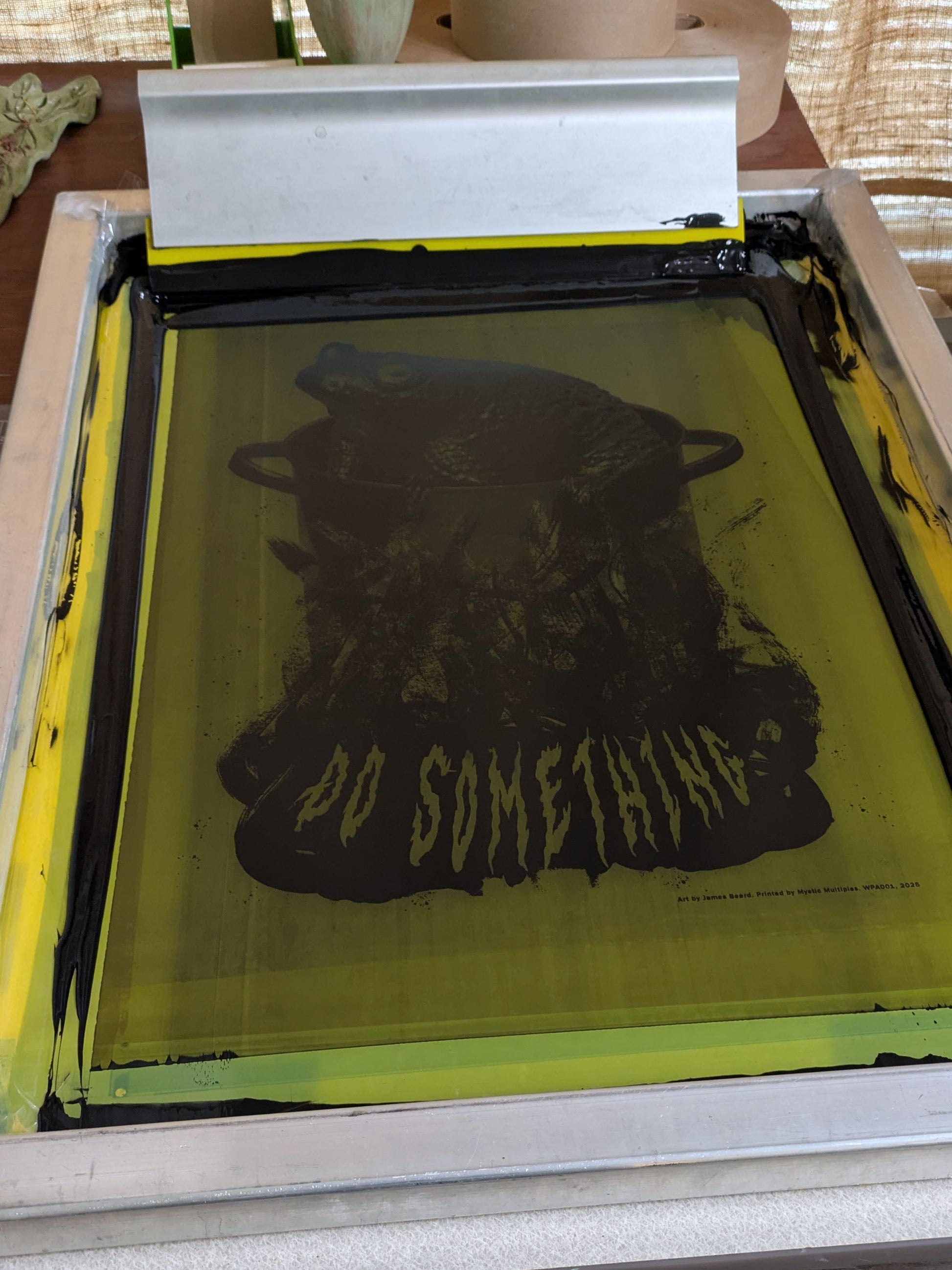 Screen printed poster with a flood of black ink