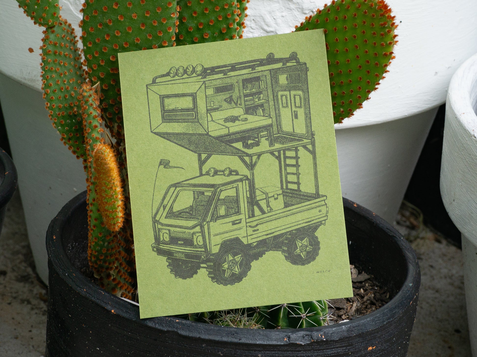 Kei truck art print on green paper in a cactus pot.