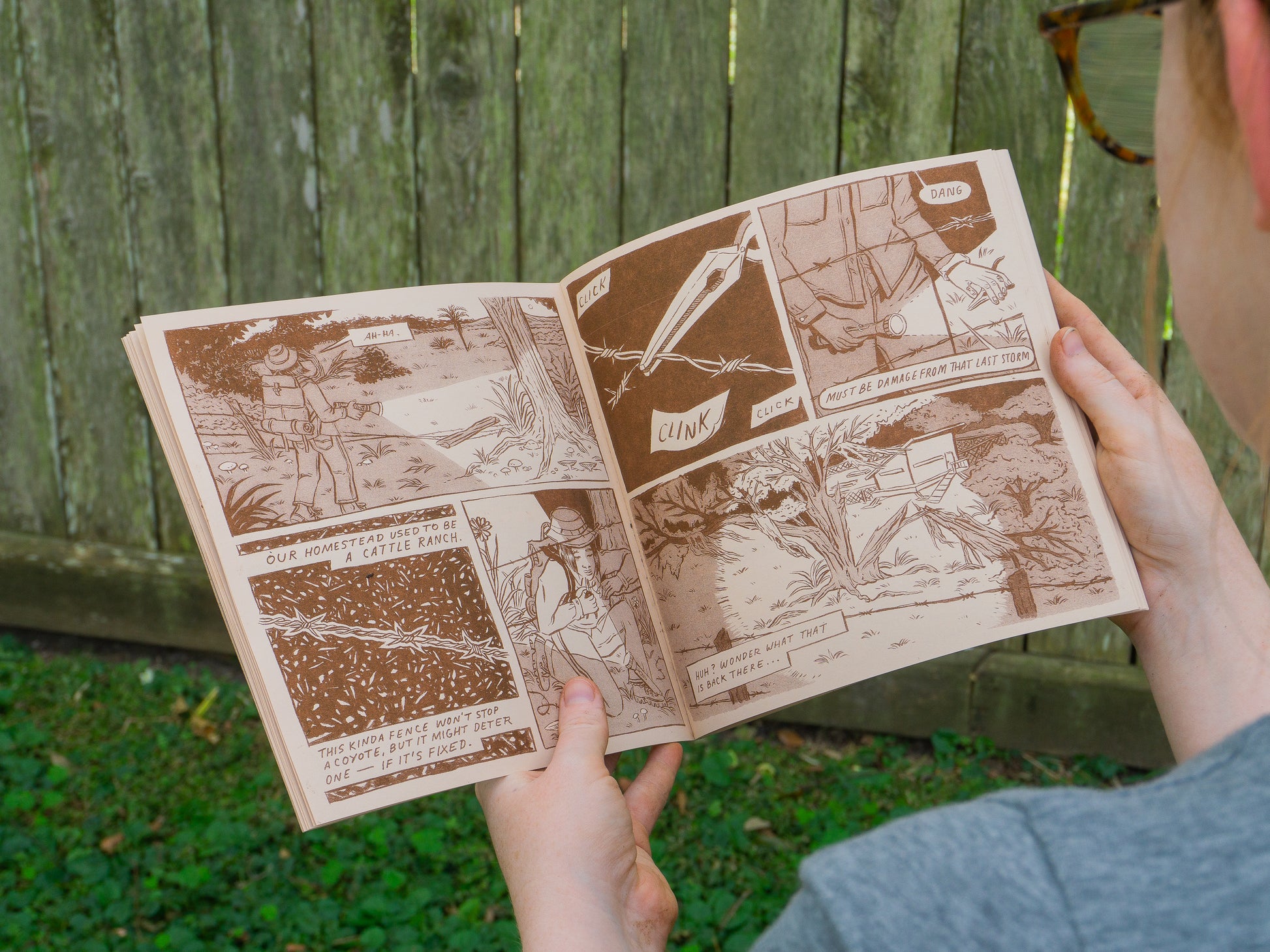 Inner pages of the comic in brown. A woman fixes barbed wire fencing in the night and discovers a shed in the woods.