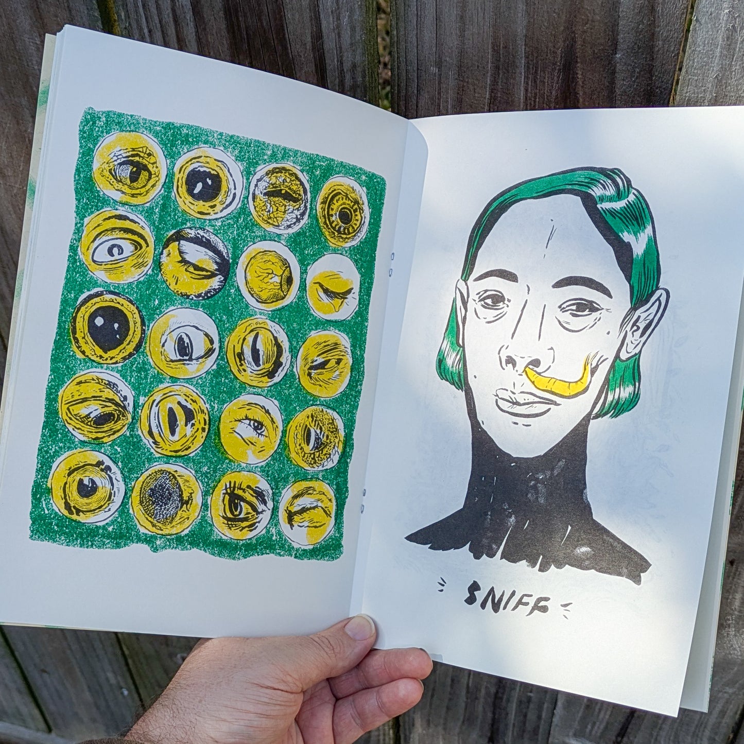 Zine spread with a grid of eye illustrations and a green haired woman with a banana slug emerging from her nostril. Text reads sniff.