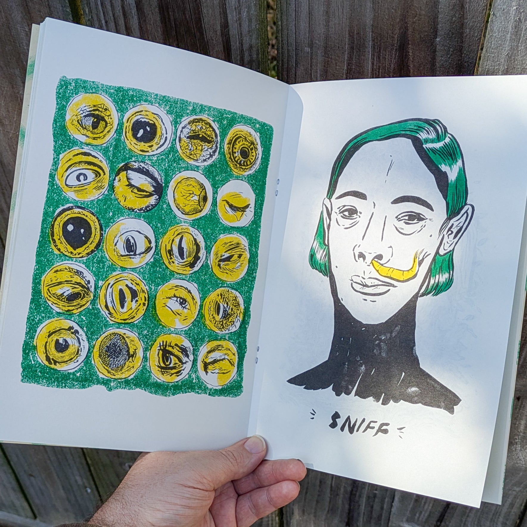 Zine spread with a grid of eye illustrations and a green haired woman with a banana slug emerging from her nostril. Text reads sniff.
