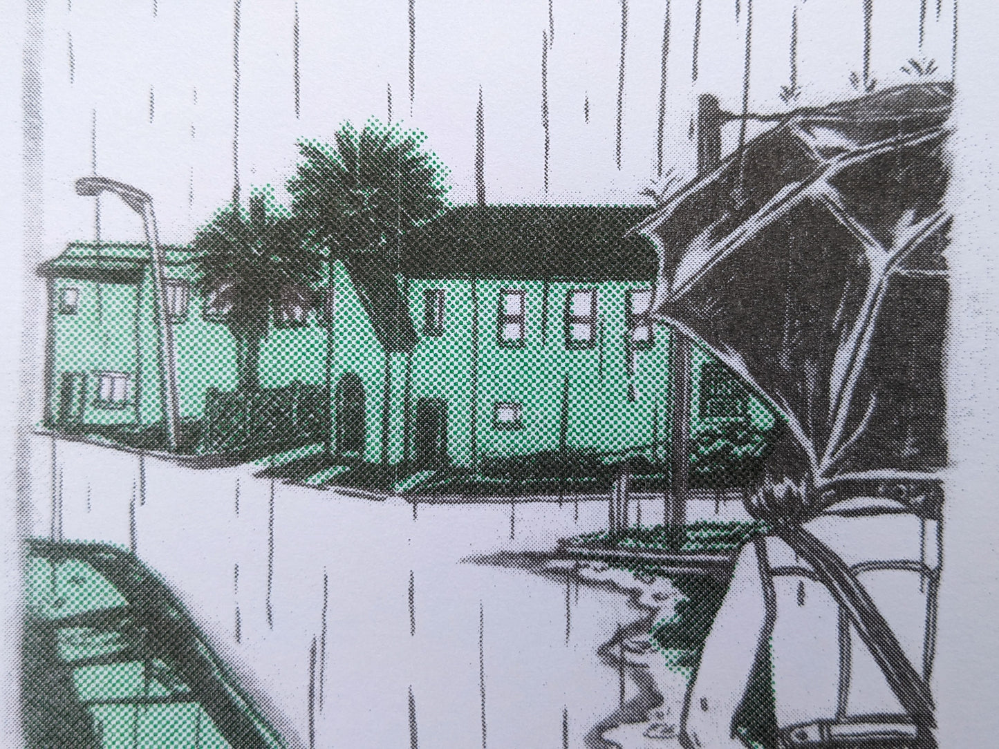 Closeup of riso art print showing a duplex on the corner of a rainy street.